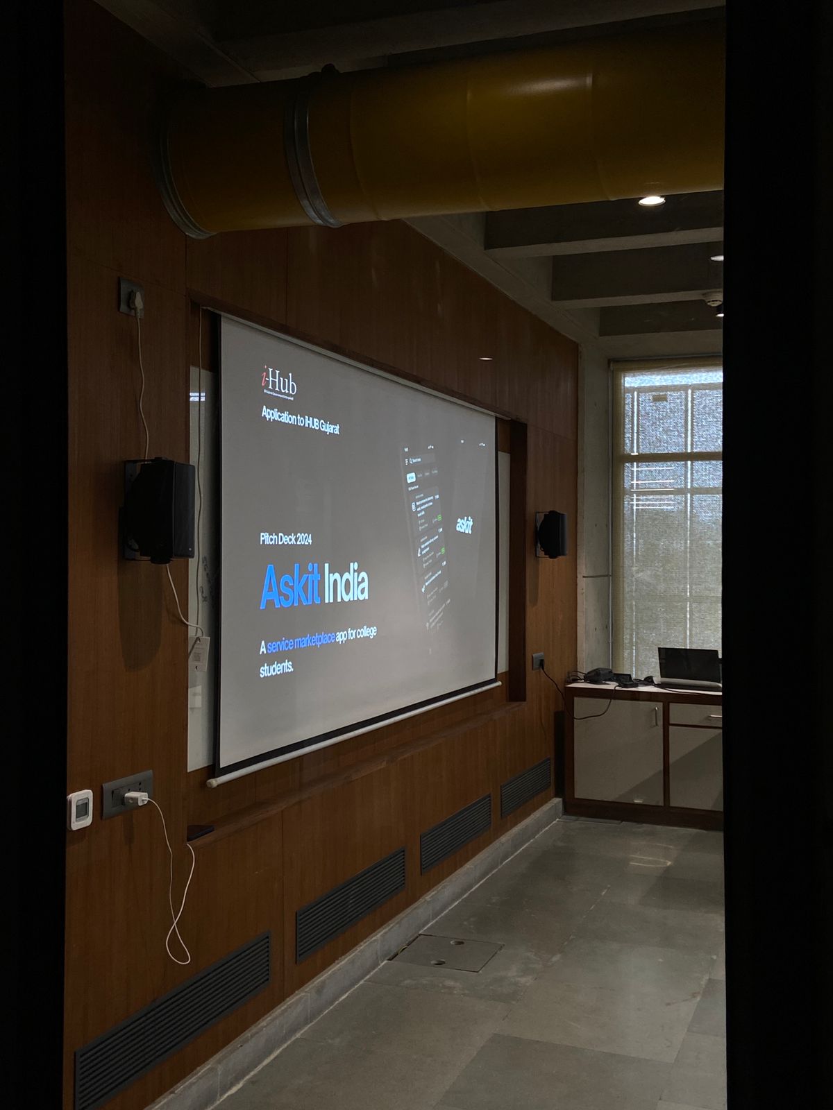 The AskIt India pitch deck projected during the iHub Gujarat application pitch